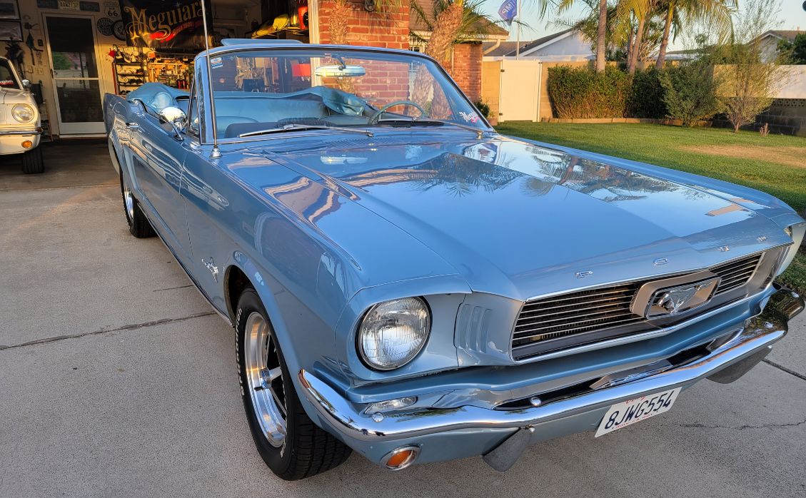 Blue 1965 Ford Mustang convertible in driveway